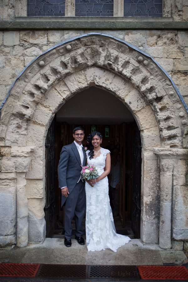 wedding couple in front of St Mary De Haura church in Shoreham